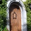San Clemente custom wine cellar door. Knotty Alder w operable speakeasy and a Chappo stain