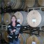Valerie enjoys a glass of wine while visiting the Sea Smoke wine cellar