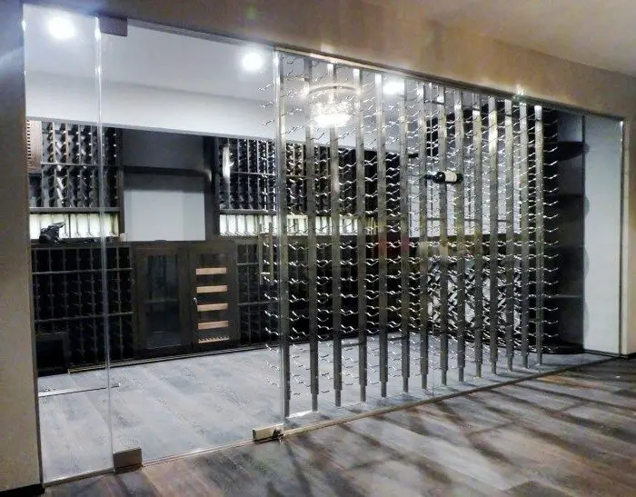 Contemporary Home Wine Cellar with Seamless Glass Door and Walls