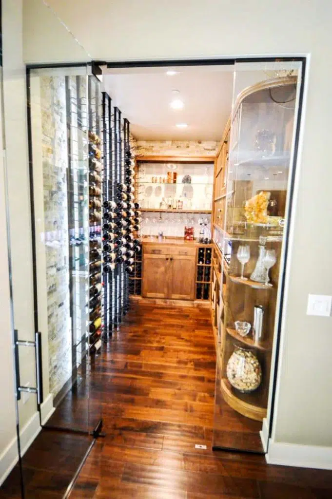 Contemporary Custom Wine Cellar with a Glass Door