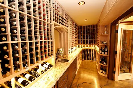 A Climate Controlled Wine Storage Room Equipped with a Reliable Cooling System and Proper Wine Cellar Lighting 