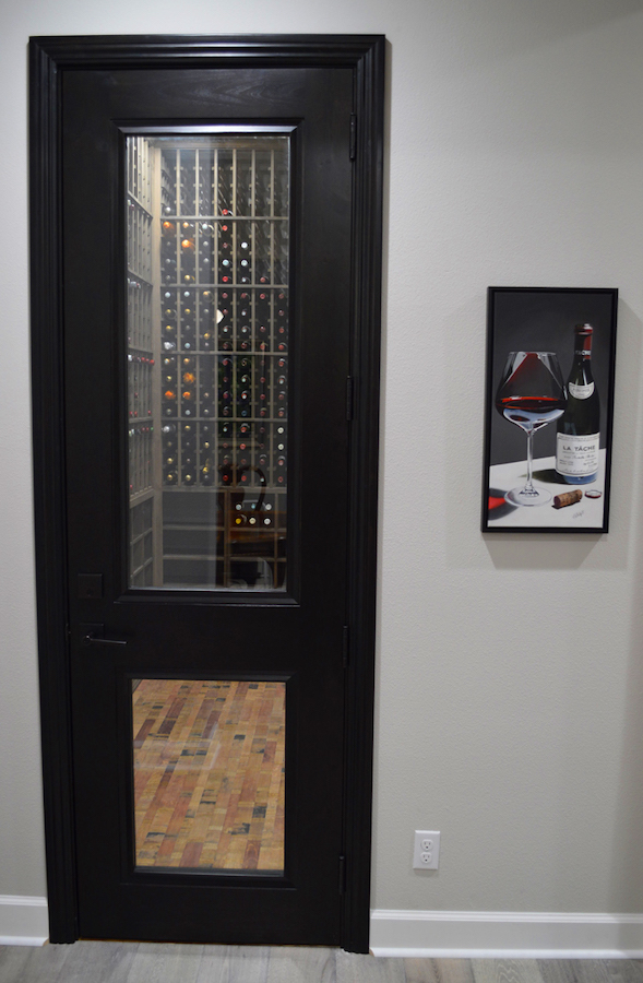 Custom Wine Racks As Seen Through Glass Wine Cellar Doors