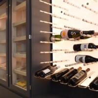 Steve and his team of experts can blend two worlds for you, in this case it's a modern and eye-catching peg wine rack system next to a beautiful and luxurious cigar humidor.