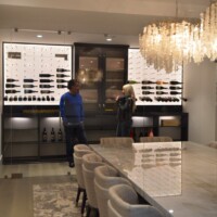 Steve and Rachel examine the finished project - a custom wine cellar in an elegant California home.