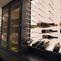 The reveal row under the wine pegs allows for a combination of display options, including an easy place to store magnum sized bottles.