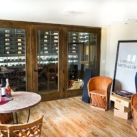 A bright and open room like this was a perfect place to add a residential glass wine cellar.