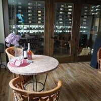 The owners of this residential wine cellar chose to add a beautiful tasting table as a place to entertain family and friends.