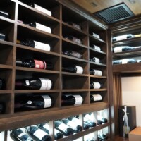 Multiple orientations of bottle storage in this residential wine cellar allow for bottles of various sizes and shapes.