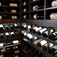 LED lights show off the gorgeous bottles in this custom display row.