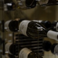 These wine cables securely support these wine bottles and create the illusion that they are floating in mid-air. Talk about innovative glass wine cellars!