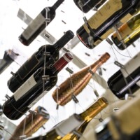 LED lighting panels at the top and bottom of this modern glass wine closet are a wonderful finishing touch.