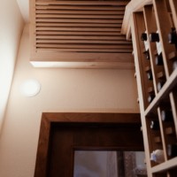 The interior cooling unit is hidden behind this custom wooden grille.