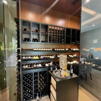 The custom cooling unit in this transitional wine cellar maintains perfect temperature and humidity.