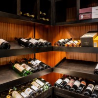 There are multiple ways to store your wine bottles in a home wine cellar like this one.