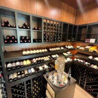 This transitional home wine cellar combines wooden and glass elements in a unique way.