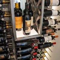 This modern display nook features an LED light panel to showcase the bottles inside.