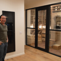 We wanted our rustic wine cellar design to merge visually with the room so we made our wooden wine racks from white ripped oak.