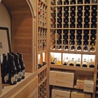 Large cubicles in wooden wine racks allow you to store wine boxes and crates. They're always handy in any rustic wine cellar design!