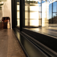 Our glass doors for this custom glass wine cellar is insulated on the edges with spray foam insulation.