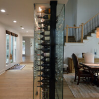 The bottles you see upfront are the magnums. Both ends of the closet have one column for magnums while the rest are columns for standard 750s. Our custom wine rack ideas also take into account what kind of wines are in your collection.