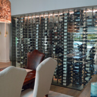 All our custom wine rack ideas take into account other components of the wine cellar like the wine cellar cooling system. Here, you'll see that the top of the racks are attached to a soffit which also houses the coils and the evaporator of the cooling system.