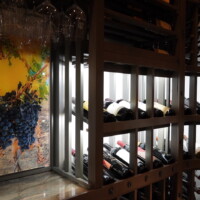 To elevate the look of our wooden wine racking more, we installed a marble countertop for the decanting table and installed a special memorabilia from the owners — a 3D art work they got from Napa Valley.