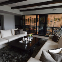 Modern wine rooms come in many sizes. Basement wine cellars commonly have low ceilings, while wine cellars in common place like the living room can have high ceilings. Asian-Inspired Modern Wine Room Design