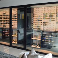 The yellow wall you see in this modern wine room is an entire light wall custom-made by the Wine Cellar Designers Group. Modern Wine Rooms LED Lighting Technology