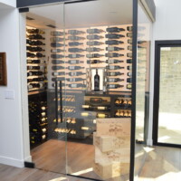Look how stunning this glass wine room looks even in broad daylight!