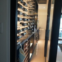 Modern wine rooms like this one often feature glass enclosures that either have aluminum framing, wooden framing, or no framing at all. Glass Casing for Modern Wine Rooms