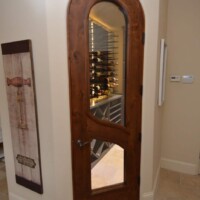 A barolo door with an LVL core and automatic bottom lock can create wonders for home wine cellars. Arched Barolo Home Wine Cellar Door