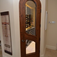 A barolo door with an LVL core and automatic bottom lock can create wonders for home wine cellars. Arched Barolo Home Wine Cellar Door