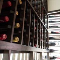 Storing wine bottles in a cork-forward, horizontal position is a visually satisfying way to organize a wine collection. Cork-forward Refrigerated Wine Cellar Racks