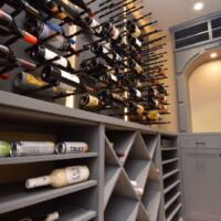 Mixing up storage styles can create an interesting feel in home wine cellars. Here, we brought in an assortment of materials and storage configurations — a design that was absolutely different from the old, plain wooden wine rack. Custom Home Wine Cellar Racks Orange County
