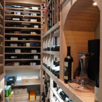 A rustic wine display theme was a great way to match the aesthetics of this contemporary home. Custom Rustic Home Wine Cellars