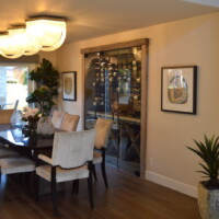 Since the home had a partially open floor plan, this small wine closet is visible from almost anywhere on the ground floor. This is the view from the living room. Glass Small Wine Cellar
