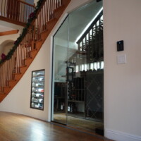 Under-the-stair spaces are often tight and wouldn't seem to be able to accommodate wine cellars. But a professional wine cellar builder and designer like Coastal can find the right solutions to fit an adequately refrigerated wine cellar under it. Refrigerated Home Wine Cellars Stairway
