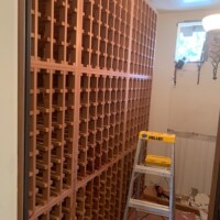 This was how the original wine cellar looked. We were already able to take out the wine cooling unit so there's a hole in the wall. Home Wine Cellar Repair Services by Coastal
