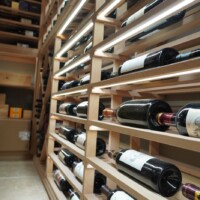 Look closely and you can see the LED strip lights beneath each horizontal row. Home Wine Room Custom Under Rack Lights