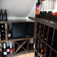 A split-system cooling unit was the best option for this refrigerated wine cellar because it was located in the center of the house. Refrigerated Wine Cellar Cooling Unit