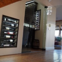 A single glass door opens this wine cellar. Stairway Refrigerated Wine Cellar