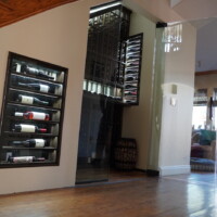 A single glass door opens this wine cellar. Stairway Refrigerated Wine Cellar