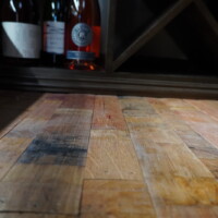 Repurposed wine barrels were our go-to flooring for this refrigerated wine cellar because of how rustic they feel. Repurposed Refrigerated Wine Cellar Flooring
