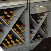 Wooden wine racks in small wine cellars can still be space maximizers if you use the right storage style like these X-bins. Small Wine Cellars Custom Wooden Racks