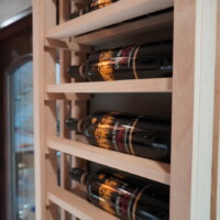 This custom wine racks was added to really maximize the available space in the home's wine room. No wall was left unused. Wall Mounted Wooden Wine Racks